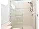 The tiled shower features a glass door and a showerhead with multiple settings at 8766 The Esplanade # 23, Orlando, FL 32836