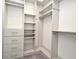 Well-organized walk-in closet with shelving, drawers, and ample storage space at 8766 The Esplanade # 23, Orlando, FL 32836