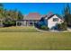 Lush backyard with screened-in pool at 885 Spring Park Loop, Celebration, FL 34747