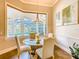 Dining area with a glass table and view of screened in pool at 885 Spring Park Loop, Celebration, FL 34747