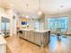 Bright kitchen featuring a large island, stainless steel appliances, and hardwood floors at 885 Spring Park Loop, Celebration, FL 34747