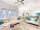 Open concept living room with bright decor, hardwood floors, and view of kitchen at 885 Spring Park Loop, Celebration, FL 34747