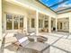 Expansive patio featuring comfortable lounge chairs, offering a great outdoor relaxation and entertainment space at 885 Spring Park Loop, Celebration, FL 34747