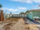 Gated backyard featuring a dirt ground and partial view of building at 901 W Donegan Ave, Kissimmee, FL 34741