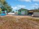 This outbuilding features a garage door, covered parking, and a large yard at 901 W Donegan Ave, Kissimmee, FL 34741