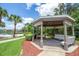 Picturesque gazebo overlooking a serene lake at 991 Lake Berkley Dr, Kissimmee, FL 34746