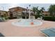 Community splash pad with colorful water features, seating, and nearby residential buildings at 991 Lake Berkley Dr, Kissimmee, FL 34746