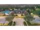 Aerial view showcasing the community clubhouse, pool, and landscaped grounds at 1894 Valley Forge Dr, St Cloud, FL 34769