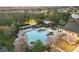 Aerial view of pool with playground, pergolas and seating at 1894 Valley Forge Dr, St Cloud, FL 34769