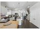 Modern kitchen with white cabinetry, stainless steel appliances, an island, and seamless flow at 1894 Valley Forge Dr, St Cloud, FL 34769