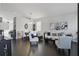 Open-concept living and dining area featuring dark hardwood floors, a neutral color palette, and stylish decor at 1894 Valley Forge Dr, St Cloud, FL 34769