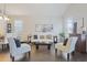 Bright living room featuring dark hardwood floors, comfortable seating, and a seamless flow at 1894 Valley Forge Dr, St Cloud, FL 34769