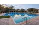 Community pool featuring clear blue water, brick pavers, and poolside seating at 1894 Valley Forge Dr, St Cloud, FL 34769