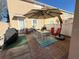 Back patio featuring a dining table with seating for six, and a large patio umbrella at 10210 Hartford Maroon Rd, Orlando, FL 32827