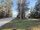 Paved walking path leading to a gated dock with water views and picnic tables at 10210 Hartford Maroon Rd, Orlando, FL 32827