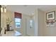 Bright bathroom featuring a glass walk-in shower, decorative towels, a modern vanity and a window providing natural light at 1111 Olivine Ave, Dundee, FL 33838