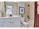 Well-lit bathroom featuring a tub-shower combination, black hardware, modern vanity, and stylish decor at 1111 Olivine Ave, Dundee, FL 33838