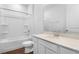 Clean bathroom featuring a shower-tub combination and modern vanity with white cabinets at 1115 Olivine Ave, Dundee, FL 33838