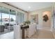 Bright dining room with sliding glass doors, contemporary decor, and tiled floor at 1115 Olivine Ave, Dundee, FL 33838