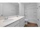Clean bathroom featuring a double vanity, mirror, shower-tub combo, and tile flooring at 1127 Olivine Ave, Dundee, FL 33838
