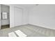 Bedroom with carpet floors and a walk-in closet at 1127 Olivine Ave, Dundee, FL 33838