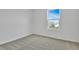 Comfortable bedroom with carpeting, window, and lots of natural light, creating a warm ambiance at 1127 Olivine Ave, Dundee, FL 33838