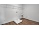 Practical laundry room with utility sink, shelving, and tile flooring, perfect for chores at 1127 Olivine Ave, Dundee, FL 33838