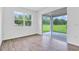 Bright bedroom with sliding glass doors opening to the outdoors, enhancing natural light and views at 1131 Olivine Ave, Dundee, FL 33838