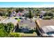 An aerial view of a home with a brick patio and lush green grass in a well-maintained neighborhood at 12622 Earnest Ave, Orlando, FL 32837