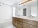 Bathroom featuring a double sink vanity and bathtub at 12622 Earnest Ave, Orlando, FL 32837