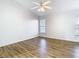 Bright bedroom features a ceiling fan and wood-look flooring at 12622 Earnest Ave, Orlando, FL 32837