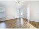 Spacious bedroom with fan, wood-look floors, and plenty of natural light at 12622 Earnest Ave, Orlando, FL 32837