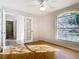 Bedroom features hardwood floors, ceiling fan, arched window and french doors at 12622 Earnest Ave, Orlando, FL 32837