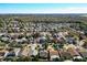 Wide aerial shot showcasing a dense, well-established neighborhood with mature trees and lush landscaping at 12622 Earnest Ave, Orlando, FL 32837