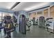 Well-equipped exercise room with modern weight machines and natural light at 1357 Venezia Ct # 302, Davenport, FL 33896