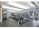 Spacious gym featuring modern treadmills, stationary bikes, weight machines, and large windows at 1357 Venezia Ct # 302, Davenport, FL 33896