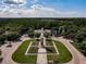 Beautiful aerial view of the community entrance with manicured landscaping and lush trees at 15147 Driftwood Bend St, Winter Garden, FL 34787