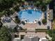 Aerial view of the community pool featuring multiple lounge chairs and umbrellas at 15147 Driftwood Bend St, Winter Garden, FL 34787