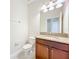 Cozy powder room featuring tile floors, granite countertops, and ample lighting at 15147 Driftwood Bend St, Winter Garden, FL 34787