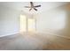 Spacious bedroom featuring a ceiling fan and neutral carpeting for a comfortable and inviting atmosphere at 15147 Driftwood Bend St, Winter Garden, FL 34787