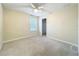 Neutrally painted bedroom featuring a ceiling fan and carpeted floors at 15147 Driftwood Bend St, Winter Garden, FL 34787