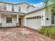 Charming two-story home with brick driveway, attached garage and covered porch at 15147 Driftwood Bend St, Winter Garden, FL 34787