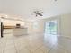 Bright open concept living room with a ceiling fan and sliding glass doors that provide natural light at 15147 Driftwood Bend St, Winter Garden, FL 34787