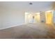 Open loft area with neutral carpeting, ideal for a playroom, home office, or additional living space at 15147 Driftwood Bend St, Winter Garden, FL 34787