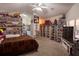 Spacious bedroom featuring vaulted ceiling, carpet flooring, and built-in shelving at 1695 Horseshoe Rd, Enterprise, FL 32725