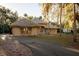 Elegant single-story home with a well-manicured lawn and curved driveway at 1695 Horseshoe Rd, Enterprise, FL 32725