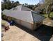 An aerial view of the garage of the single-Gathering home with neutral tile roof at 1695 Horseshoe Rd, Enterprise, FL 32725