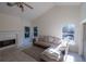 Living room with fireplace, tile flooring, neutral paint colors, and large windows at 1695 Horseshoe Rd, Enterprise, FL 32725