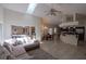 Bright and airy living room featuring vaulted ceilings, tile floors, and an open concept design at 1695 Horseshoe Rd, Enterprise, FL 32725