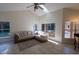 Bright living room with vaulted ceilings, neutral tones, and plenty of natural light from the windows at 1695 Horseshoe Rd, Enterprise, FL 32725